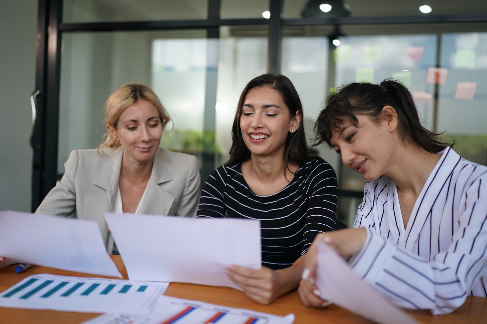 Businesswoman Making Business Presentation For Colleagues In Modern Office