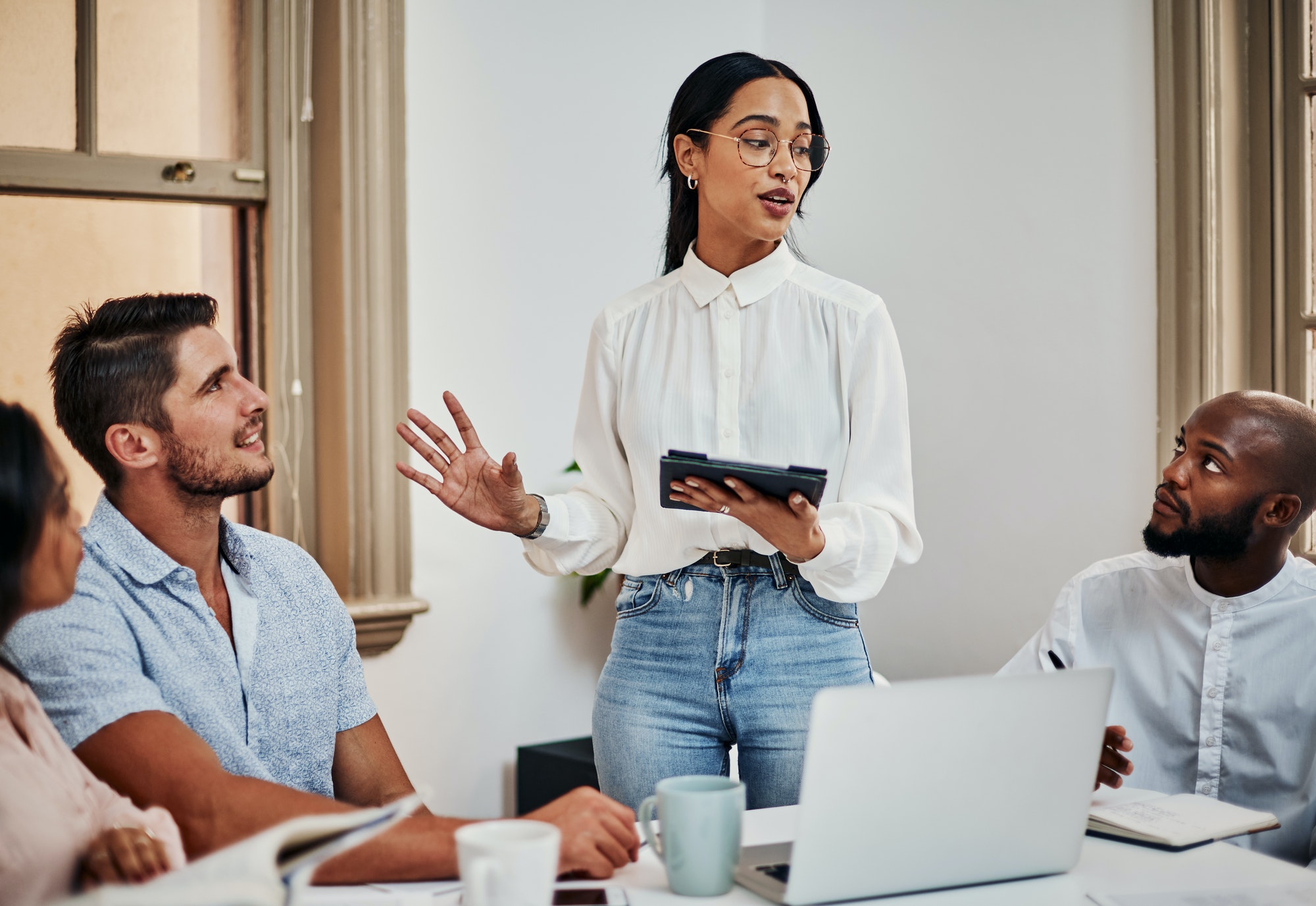 Is everyone on board. Shot of a group of businesspeople having a meeting in a modern office.